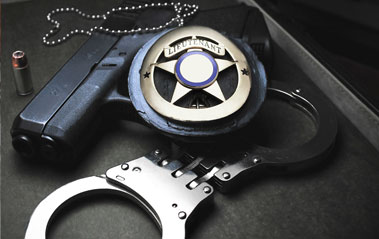 Badge, gun, handcuffs